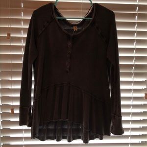 Brown long sleeve shirt with ruffles on the bottom
